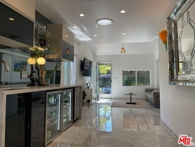 Welcome to a captivating coastal Mediterranean-style retreat in - photo 15