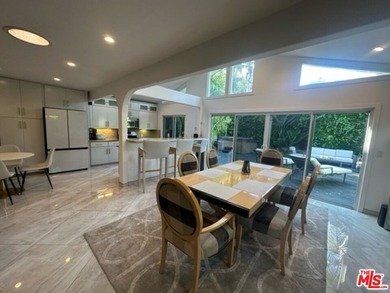 Welcome to a captivating coastal Mediterranean-style retreat in - photo 27