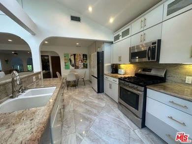 Welcome to a captivating coastal Mediterranean-style retreat in - photo 29