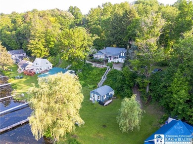 Welcome to 4896 Ashville Bay Road, a rare lakefront retreat on - photo 3