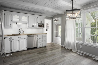 Enjoy lakefront living on Wilson Lake with 125' of waterfront, a - photo 9