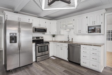 Enjoy lakefront living on Wilson Lake with 125' of waterfront, a - photo 10