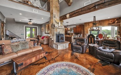 This rustic lodge-style retreat sits on approximately 7.5 acres - photo 2