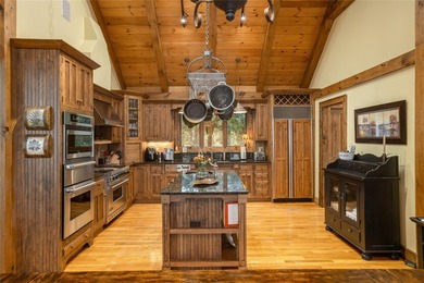 Set along the banks of the Horsepasture River, this exceptional - photo 25