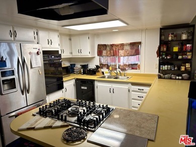 Spacious and rare 4-bedroom, 2-bath double-wide located in the - photo 4
