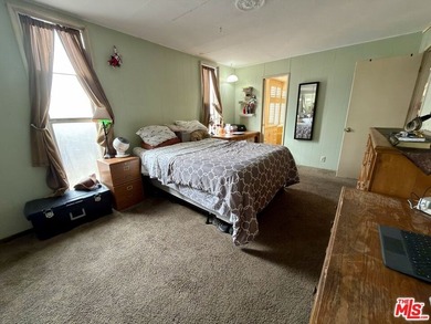 Spacious and rare 4-bedroom, 2-bath double-wide located in the - photo 6