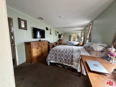 Spacious and rare 4-bedroom, 2-bath double-wide located in the - photo 7