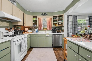 Nestled in the heart of Park Hill, this inviting home offers the - photo 2