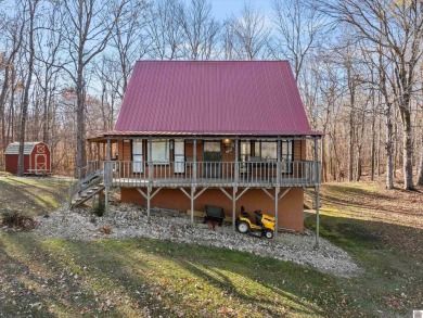 Nestled on nearly 53 acres, this multi-level cabin offers a - Lake Home For Sale in Eddyville, Kentucky