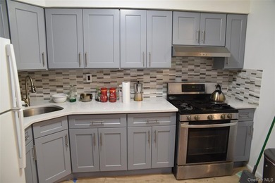Baychester Area Updated 2 Family Brick attached Home with a - photo 10