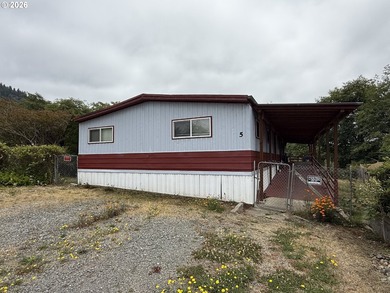 This spacious 1,800+ square foot manufactured home offers an - photo 1