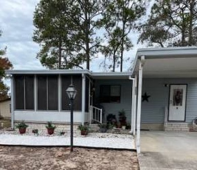 Welcome to this well kept 2 bedroom, 2 bathroom manufactured - photo 1