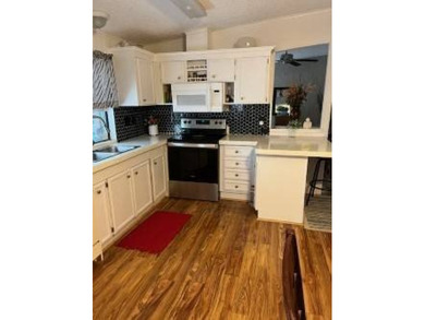 Welcome to this well kept 2 bedroom, 2 bathroom manufactured - photo 6
