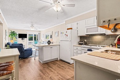 This bright two-bedroom, two-bath condominium is perched in a - photo 7