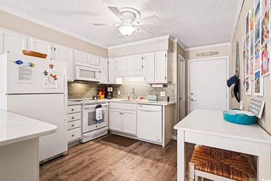 This bright two-bedroom, two-bath condominium is perched in a - photo 8