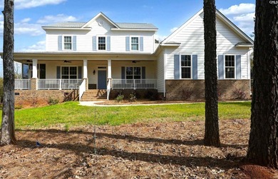 Modern comfort meets relaxed lake living on this spacious 1-acre - photo 1