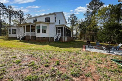 Modern comfort meets relaxed lake living on this spacious 1-acre - photo 3