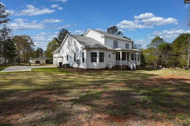 Modern comfort meets relaxed lake living on this spacious 1-acre - photo 4