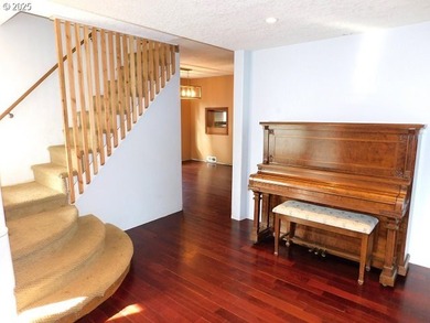 Step into the welcoming entryway, where gleaming hardwood floors - photo 4