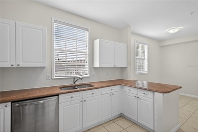 FRESHLY PAINTED AND NEW CARPETING: Beautiful townhome-style - photo 8