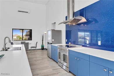 This stunning 3-bedroom, 3-bath contemporary Gulf access home