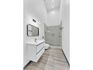 This stunning 3-bedroom, 3-bath contemporary Gulf access home