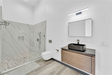 This stunning 3-bedroom, 3-bath contemporary Gulf access home