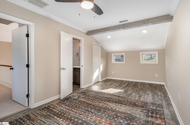 Located in the sought-after Smithfields golf community, this