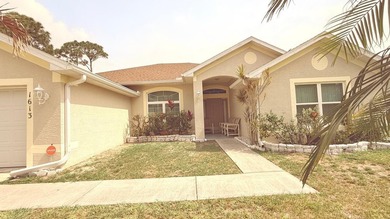 Welcome to this beautifully maintained Port St. Lucie home - photo 1