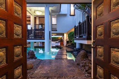 This oceanfront four-bedroom, four-bathroom residence within - photo 3