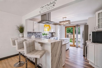 Welcome to this beautifully maintained Expanded Cape nestled in - photo 6