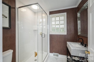 Set on a private .7-acre lot in North Asheville, this 3-bedroom - photo 15
