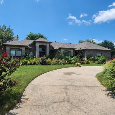 This custom built home with a circular driveway sits in a well - photo 3