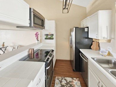 Welcome to this updated top floor two bedroom, two bath condo at - photo 5