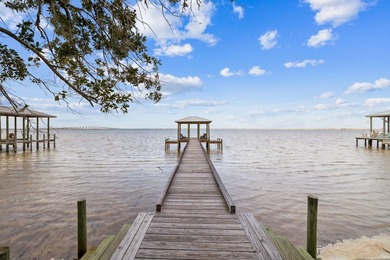 This exceptional 0.33-acre homesite offers bay views within the - photo 17