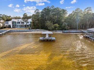 This exceptional 0.33-acre homesite offers bay views within the - photo 21