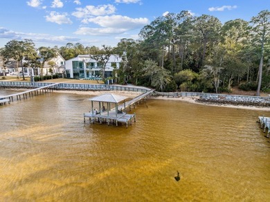 This exceptional 0.33-acre homesite offers bay views within the - photo 22