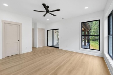 This new construction modern lake home is so fresh the walls - photo 10