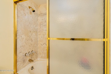 Perched high above the shoreline, this exceptional 12th-floor