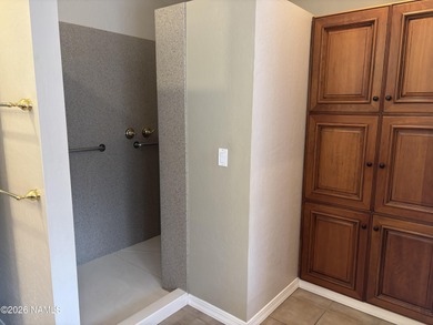 Fantastic golf course location home. Cedar siding and rock