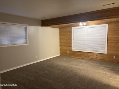 Fantastic golf course location home. Cedar siding and rock