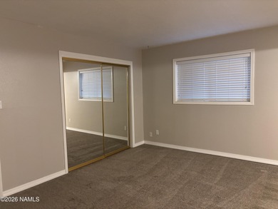 Fantastic golf course location home. Cedar siding and rock