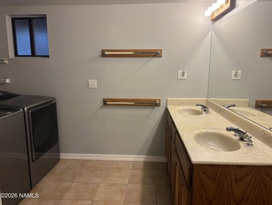 Fantastic golf course location home. Cedar siding and rock