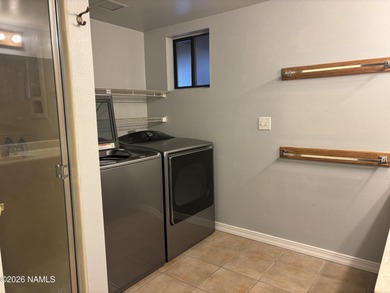 Fantastic golf course location home. Cedar siding and rock