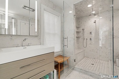 Fully remodeled with top-of-the-line finishes throughout, this - photo 12
