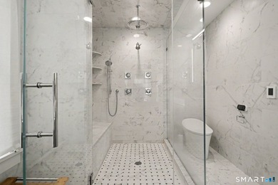 Fully remodeled with top-of-the-line finishes throughout, this - photo 13