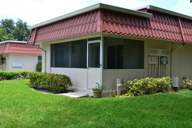 Welcome to this desirable 55+ community End-unit villa in the - photo 1
