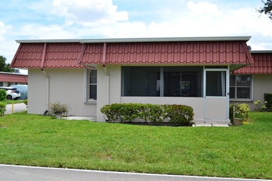 Welcome to this desirable 55+ community End-unit villa in the - photo 3