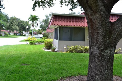 Welcome to this desirable 55+ community End-unit villa in the - photo 4