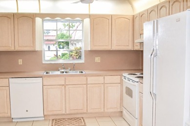 Welcome to this desirable 55+ community End-unit villa in the - photo 8